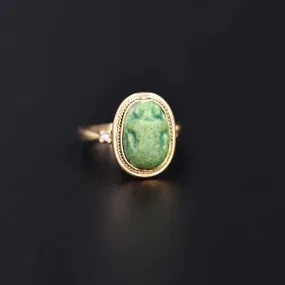 An Egyptian Green Glazed Faience Scarab, Amarna Period, ca. 1353 - 1336 BCE