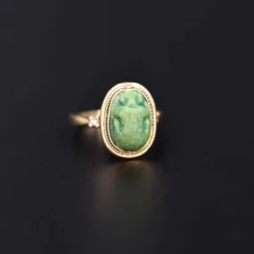 An Egyptian Green Glazed Faience Scarab, Amarna Period, ca. 1353 - 1336 BCE
