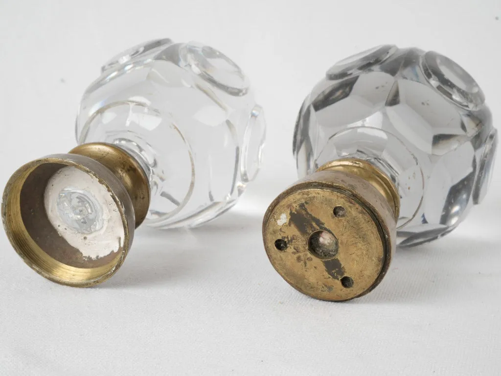 Antique French inexact pair of round clear glass 'Boule d'escalier’ newel caps w/ brass bases 7"