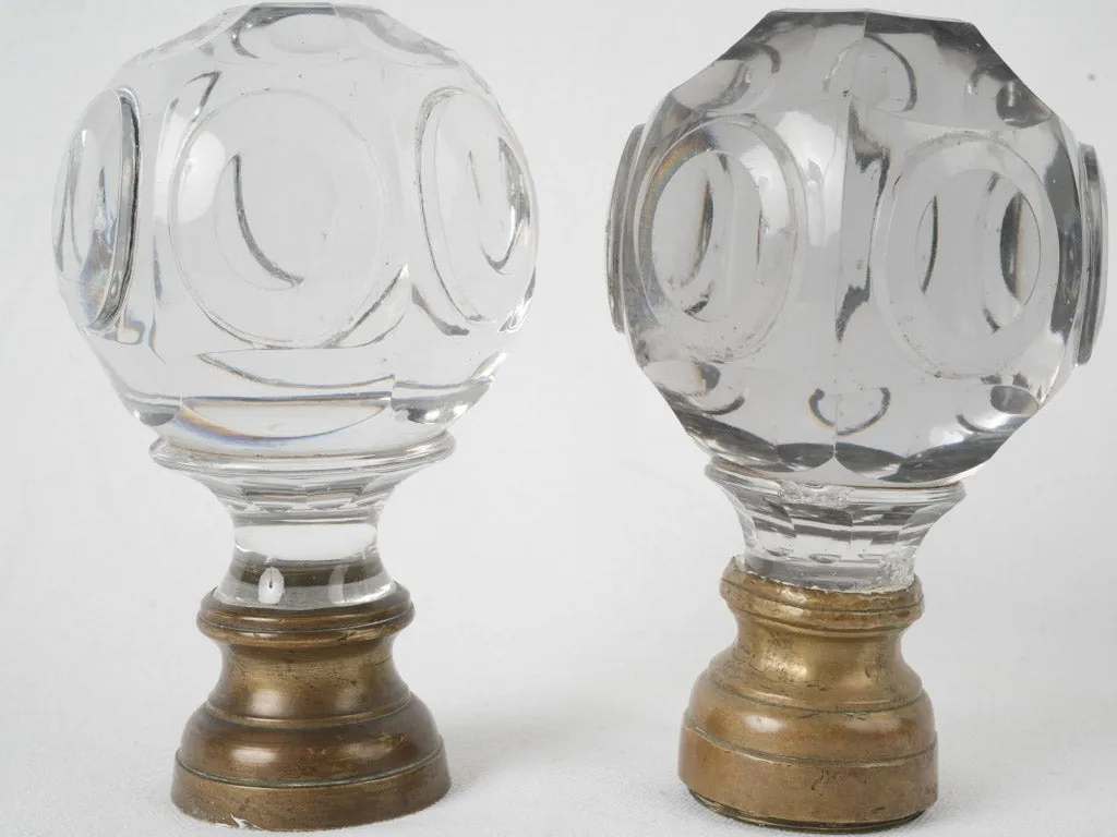 Antique French inexact pair of round clear glass 'Boule d'escalier’ newel caps w/ brass bases 7"