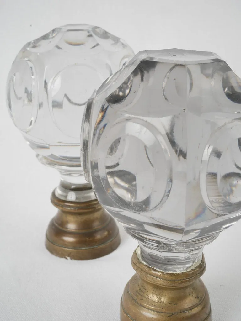 Antique French inexact pair of round clear glass 'Boule d'escalier’ newel caps w/ brass bases 7"